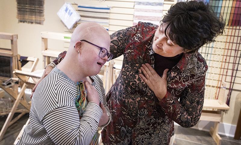 Alumna Diane Nelson with a student at the Annandale Textile Center